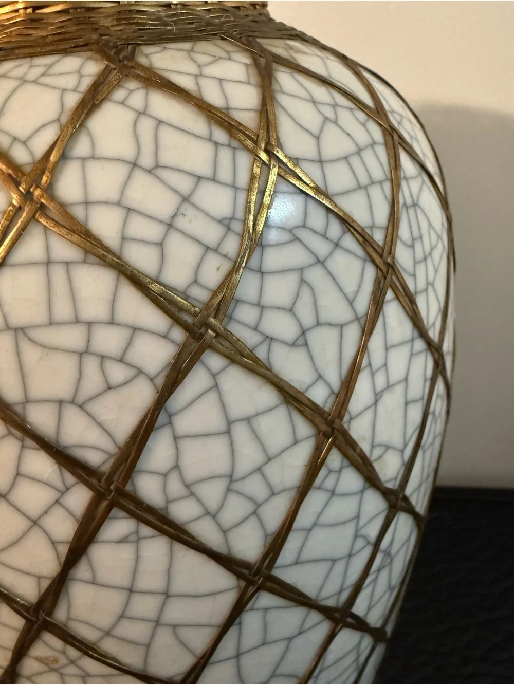Japanese pottery vase craquelure glaze and a basketweave metal overlay.